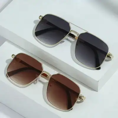 Elegant sunglasses featuring gold metal frames and tinted lenses, perfect for fashion and sun protection. Available at Monalisa Store for stylish eyewear accessories.