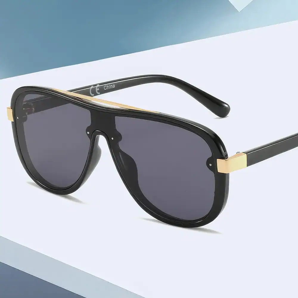 High-end black sunglasses with gold accents, stylish design, UV protection, perfect for fashion-forward individuals and outdoor use.