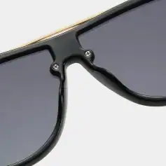 High-quality black sunglasses with tinted lenses, trendy design, durable frame for men and women, UV protection, perfect for summer and outdoor activities.