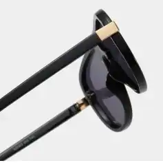 High-quality black sunglasses with gold details, perfect for UV protection and fashion statement. Ideal for outdoor activities, providing both style and eye safety.