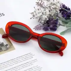 Bold red oval sunglasses with dark lenses for stylish sun protection and UV defense. Perfect for women seeking trendy, high-quality eyewear for outdoor activities.