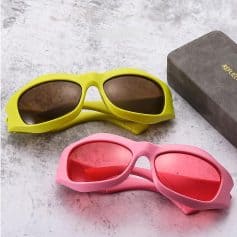 Child-safe sunglasses with yellow and pink frames, polarized lenses, and durable construction for active kids.