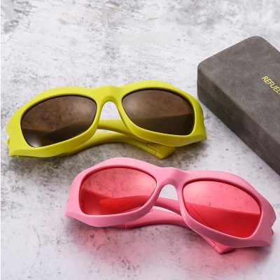 Child-safe sunglasses with yellow and pink frames, polarized lenses, and durable construction for active kids.
