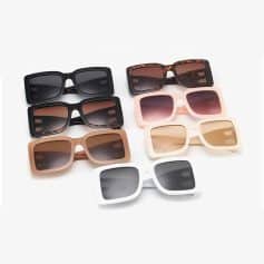 Stylish variety of sunglasses for women and men at Monalisa Medical Store, including black, tortoise shell, pink, beige, and white frames with tinted lenses.