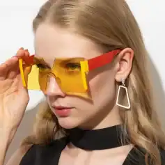 Vibrant yellow and red oversized fashionable sunglasses with modern design, perfect for style and sun protection, available at Monalisa Medical Store.