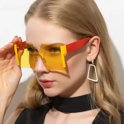 Vibrant yellow and red oversized fashionable sunglasses with modern design, perfect for style and sun protection, available at Monalisa Medical Store.