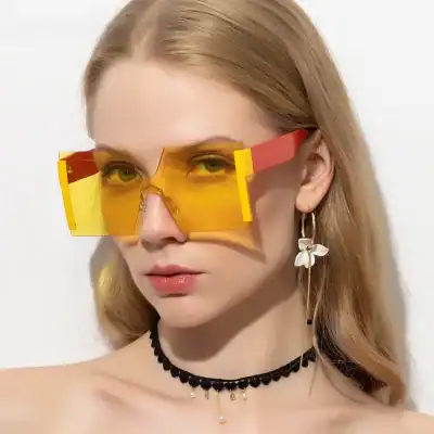 High fashion yellow tinted oversized sunglasses for women, stylish and bold eyewear perfect for fashion-forward looks and UV protection.