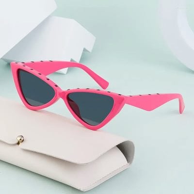 Sunglasses for women and men, trendy pink optical glasses, UV protection eyewear, fashionable accessories for summer.