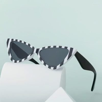 Stylish black and white striped sunglasses with dark lenses, perfect for summer or fashion statements. Unique design adds a trendy touch for any outfit.