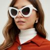 Stylish white oversized cat-eye sunglasses for women, perfect for fashion, sun protection, and trendy accessories. Ideal for summer and outdoor wear.