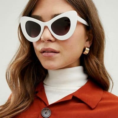 Stylish white oversized cat-eye sunglasses for women, perfect for fashion, sun protection, and trendy accessories. Ideal for summer and outdoor wear.
