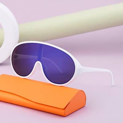 Stylish white sunglasses with dark lenses displayed on a colorful background, perfect for eye protection and fashion.