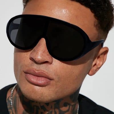 High-quality black sunglasses for men with UV protection and stylish oversized design. Perfect for outdoor fashion, sun protection, and daily wear to enhance your look.