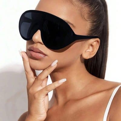 Stylish large black sunglasses for women with UV protection, perfect for sunny days and fashion-forward looks. Ideal for eye health and style enhancement.