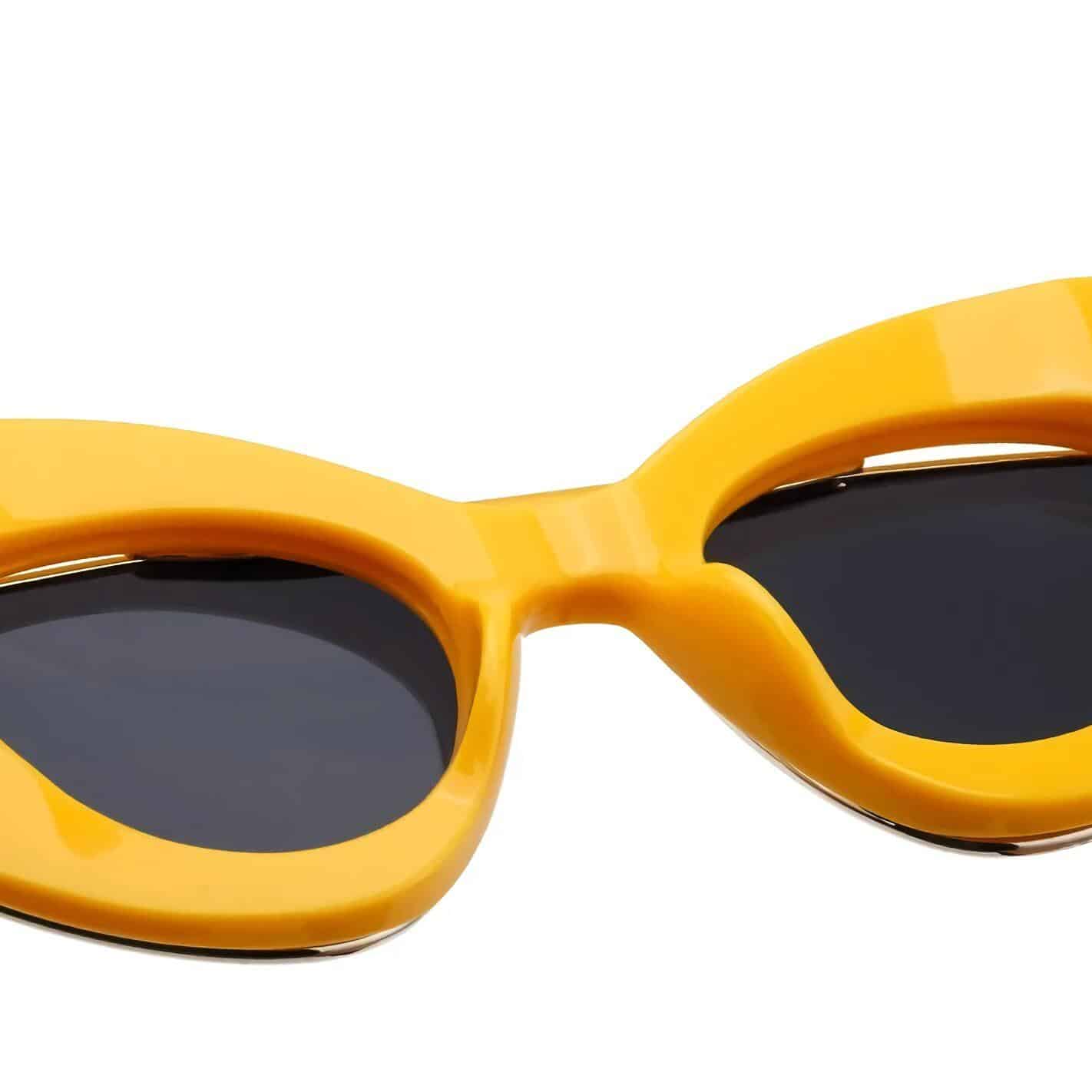 Bright yellow sunglasses with black lenses, fashionable and functional eyewear accessories. Ideal for sun protection, outdoor adventures, and making bold style statements.