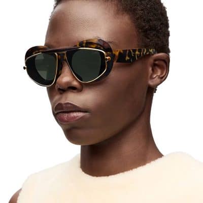 Stylish tortoiseshell sunglasses with gold accents, perfect for summer and fashion-forward looks.
