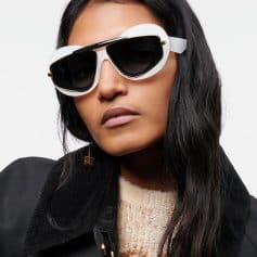 Stylish oversized black and white sunglasses with gold accents, perfect for trendy women's eyewear and UV protection.