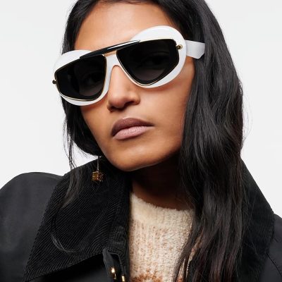 Stylish oversized black and white sunglasses with gold accents, perfect for trendy women's eyewear and UV protection.