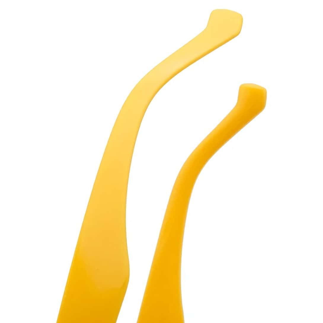 Close-up of modern, vibrant yellow glasses earpieces, showcasing eyewear accessories for fashionable vision correction.