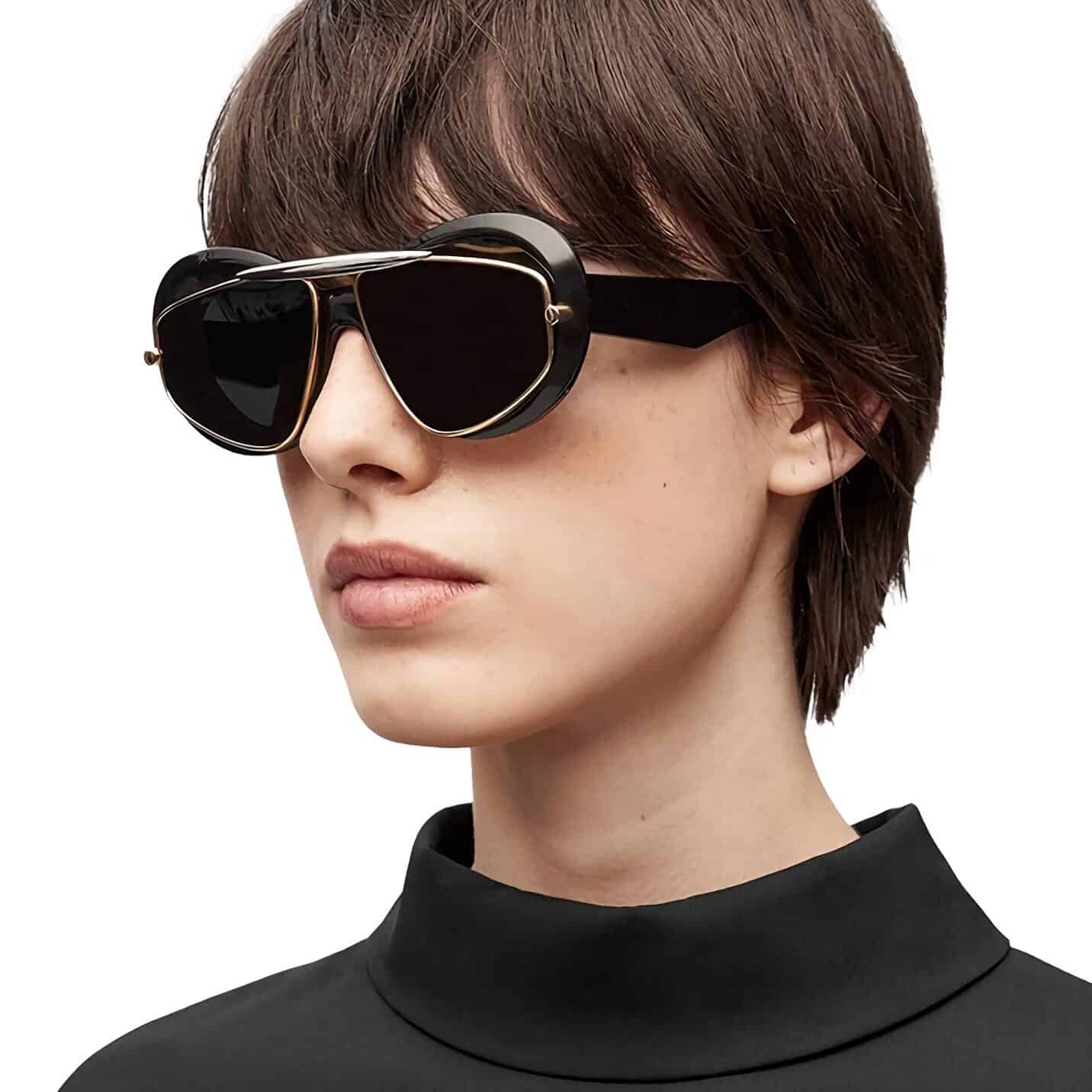 High-quality women's sunglasses with dark lenses, black and gold frame, stylish design, UV protection, perfect for fashion-forward individuals seeking a chic look.