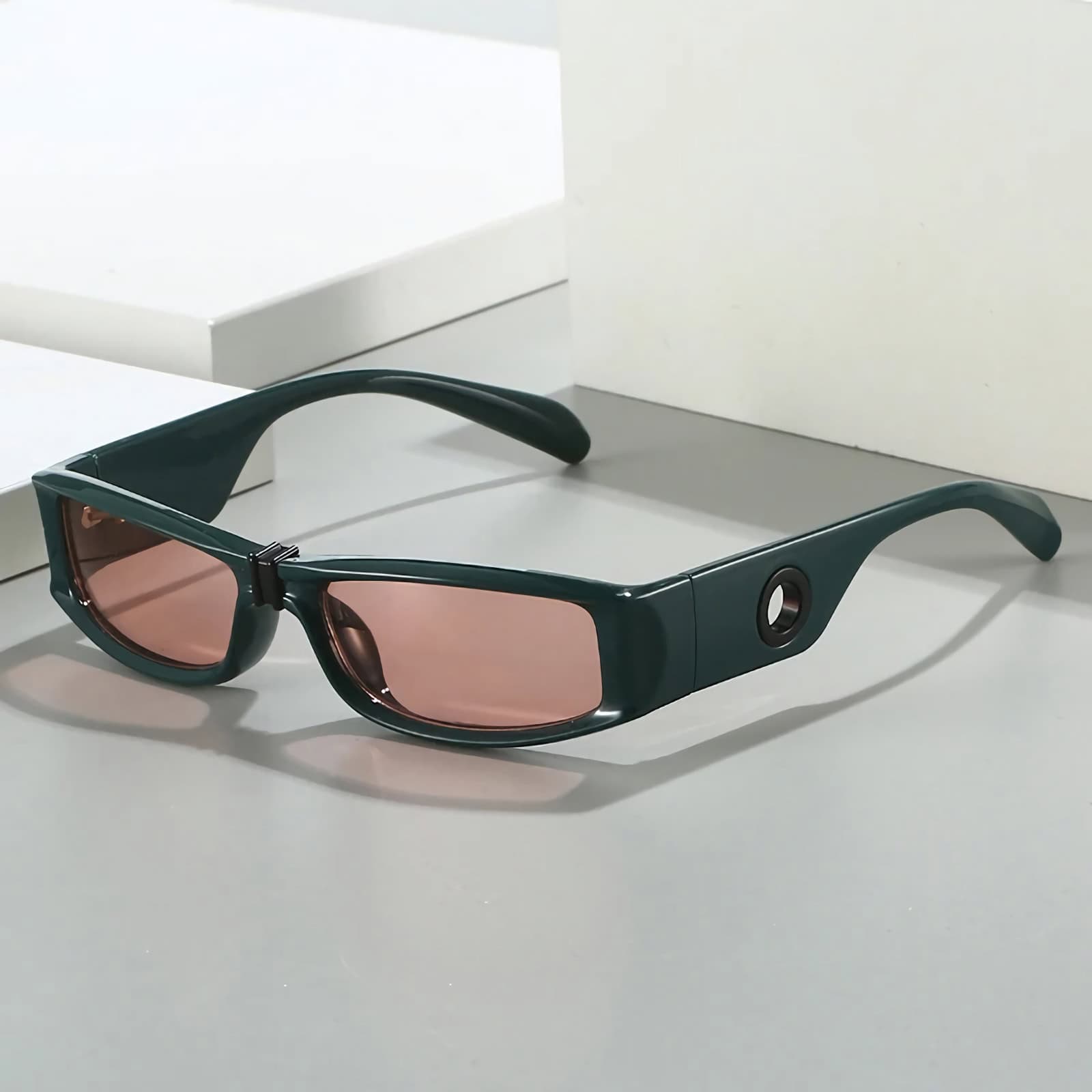High-tech smart sunglasses with pink-tinted lenses for enhanced vision and style. Perfect for modern eyewear and optical accessories.