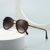 Fashionable sunglasses featuring a brown gradient lens and metal frame, ideal for UV protection and stylish eyewear. Perfect accessory for sunny days and outdoor activities.