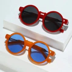 Vibrant red and orange round kids' sunglasses with tinted lenses, stylish and protective eyewear for children available at Monalisa Store for fashionable eye health.