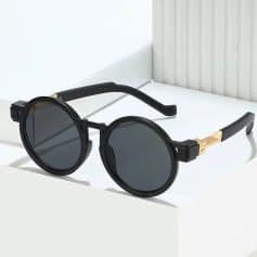 Black round sunglasses with tinted lenses and gold accents, perfect for summer fashion, UV protection, and sun protection, available at Monalisa Medical Store.