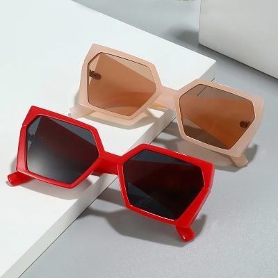 Retro oversized sunglasses with tinted lenses, perfect for fashion-forward eye protection and UV defense. Trendy accessory for sunny days and outdoor activities.