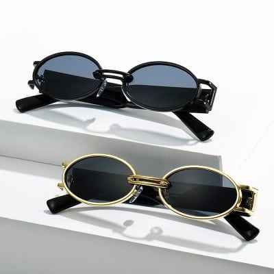 Stylish oval sunglasses with black and gold frames, perfect for UV protection and fashion. Ideal for trendy eyewear shoppers seeking premium sunglasses.