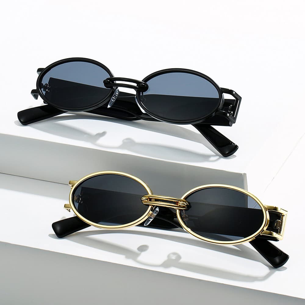 Stylish oval sunglasses with black and gold frames, perfect for UV protection and fashion. Ideal for trendy eyewear shoppers seeking premium sunglasses.