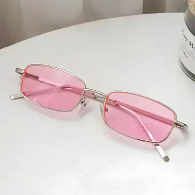 Pink-tinted rectangular sunglasses with metal frame for fashionable eye protection and UV blocking. Perfect for outdoor activities and enhancing your trendy look.