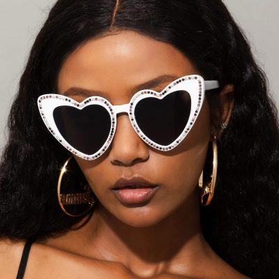 Stylish heart-shaped black sunglasses with sparkling rhinestone accents, perfect for fashion-forward individuals. Ideal for trendy accessories and eye health protection.