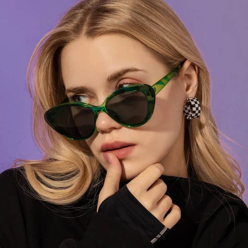 Chic green sunglasses with dark lenses, perfect for fashionable women seeking trendy eye accessories from Monalisa Store.