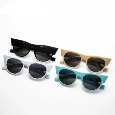 Stylish and UV-protected kids' sunglasses in black, white, beige, and turquoise. Fun and durable eyewear perfect for outdoor activities and sun protection for children.