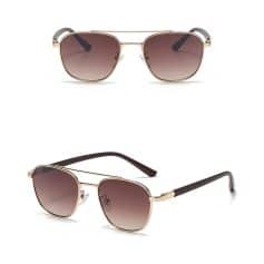 Stylish sunglasses with gold frames and gradient lenses, perfect for sun protection and fashion. Ideal for women and men seeking luxury eye accessories.