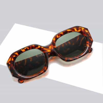 Stylish tortoise shell sunglasses with dark lenses, perfect for fashion and UV protection. Shop designer eyewear at Monalisa Medical Store for premium quality and trendy styles.