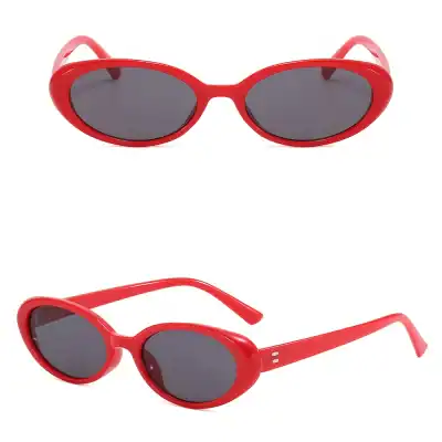Stylish red oval sunglasses with dark lenses, perfect for UV protection and fashion. Ideal for women and men seeking modern, eye-catching eyewear at Monalisa Store.