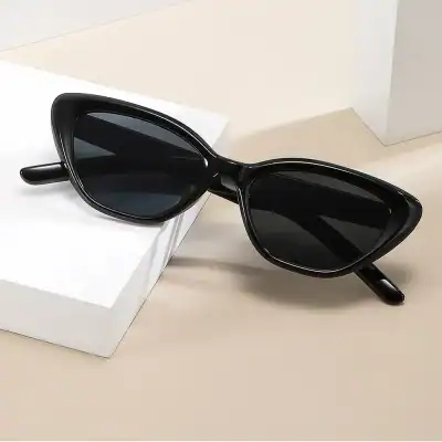 Alt text: Modern black sunglasses with oversized frames and dark tinted lenses, perfect for fashionable sun protection and enhancing your eye care accessories collection.