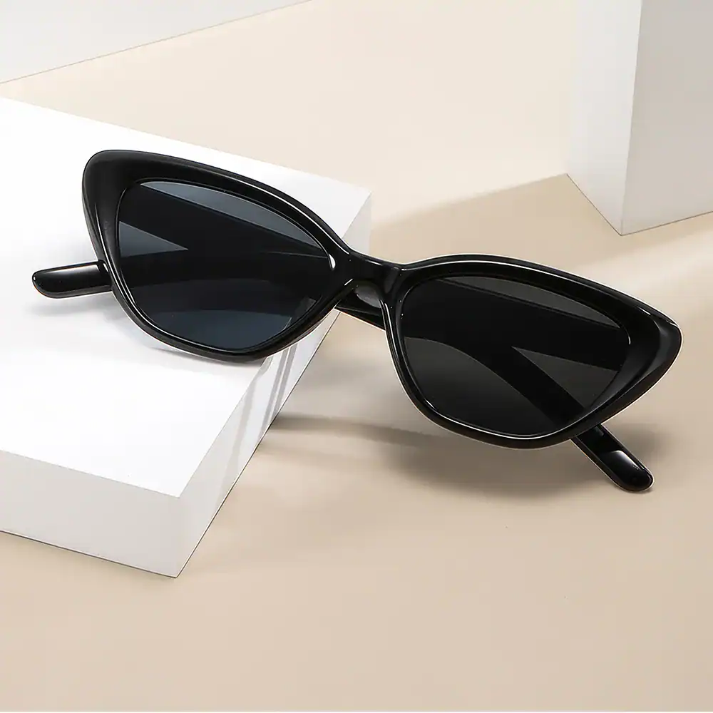 Alt text: Modern black sunglasses with oversized frames and dark tinted lenses, perfect for fashionable sun protection and enhancing your eye care accessories collection.