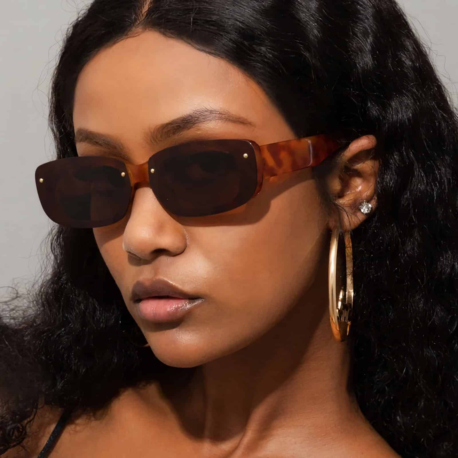High-quality tortoiseshell sunglasses featuring dark lenses, ideal for trendy and elegant outfits. Shop at Monalisa Store for premium eyewear selections.
