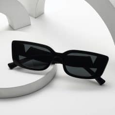 Stylish black sunglasses with rectangular frames and tinted lenses, ideal for trendy eye protection and fashion accessories. Perfect for opt store showcase or eyewear shopping.