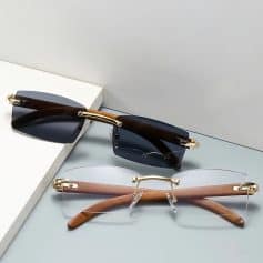 Fashionable designer sunglasses with dark tinted lenses, gold detailing, and stylish frames designed for UV protection and enhancing your outdoor look.