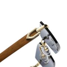 Close-up of luxury optical sunglasses with wooden and gold accents, stylish and high-quality eyewear for optimal vision and fashion. Perfect for stylish eyewear shoppers.