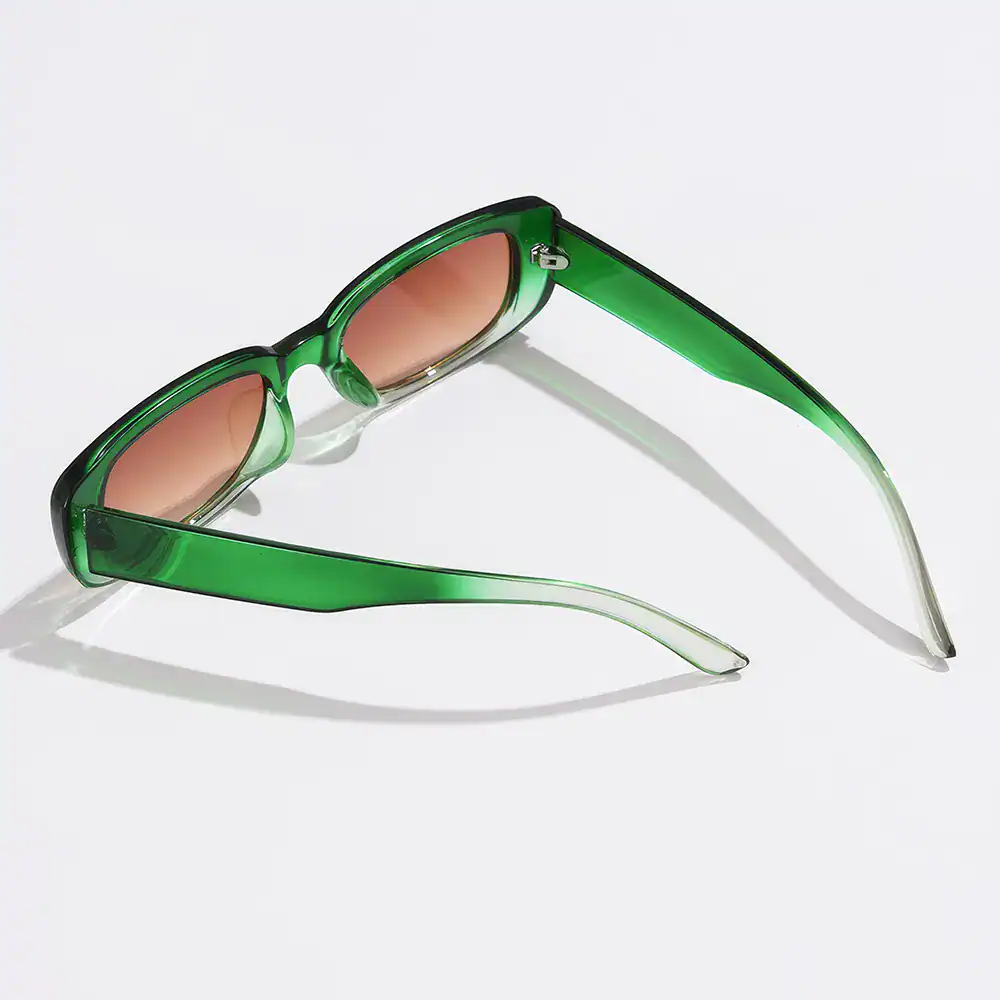 Stylish green sunglasses with brown tinted lenses, perfect for UV protection and fashion. Comfortable and trendy eyewear for everyday use.