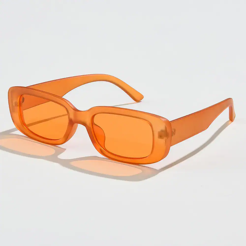 Bright orange, trendy vintage sunglasses with rectangular lenses for stylish eye protection and UV coverage. Perfect for fashion-forward individuals.