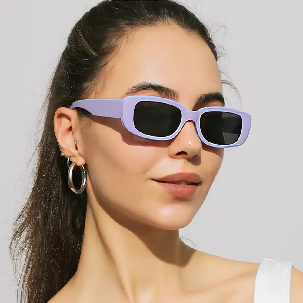 Stylish purple sunglasses with black lenses, perfect for sunny days and fashion-forward looks. Perfect for enhancing your summer wardrobe.