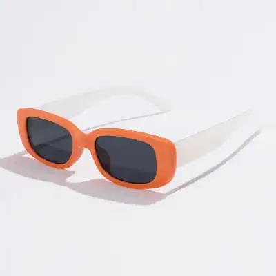 Bright orange sunglasses with dark tinted lenses, ideal for UV protection and trendy summer accessories. Great for fashion-forward individuals seeking stylish sun eyewear.