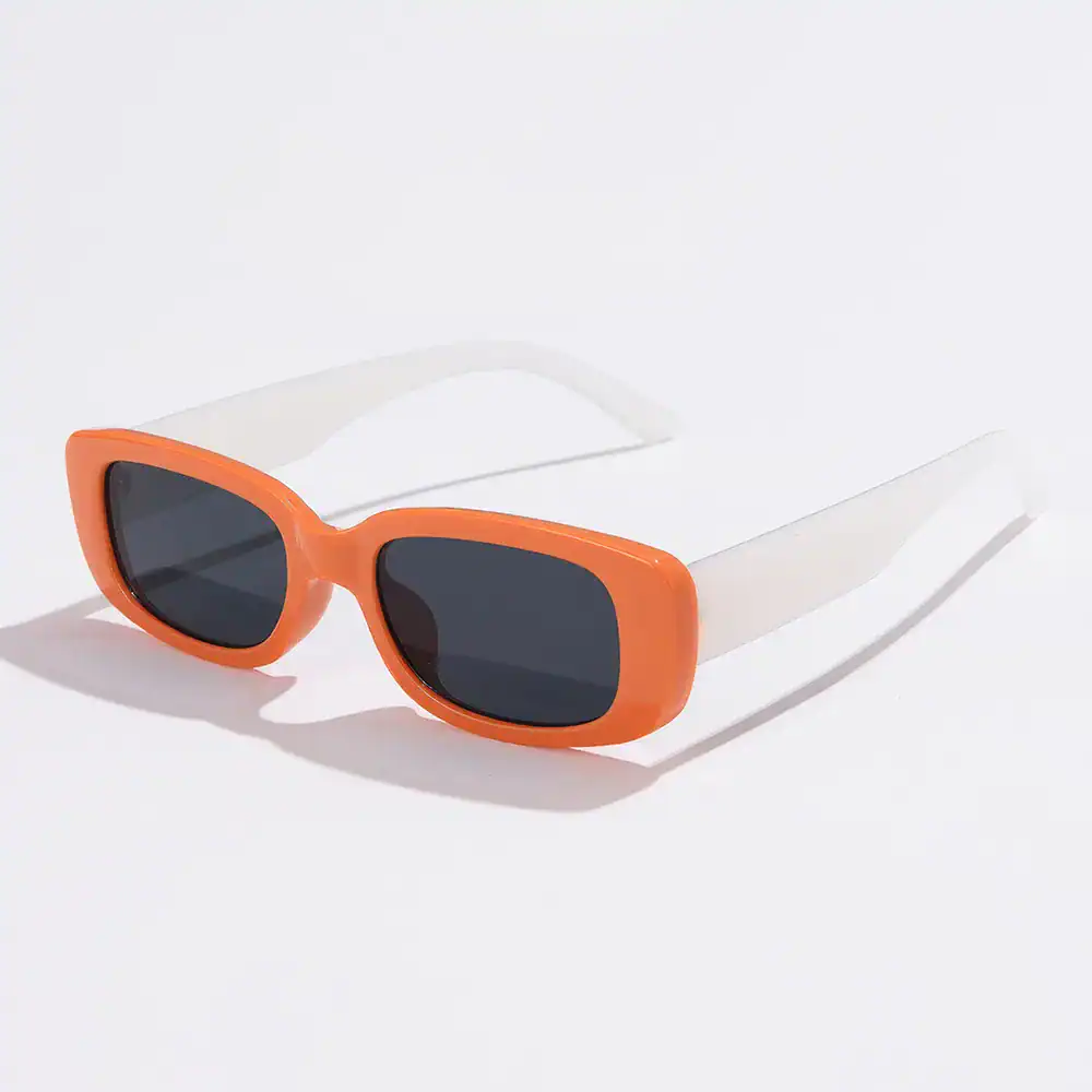 Bright orange sunglasses with dark tinted lenses, ideal for UV protection and trendy summer accessories. Great for fashion-forward individuals seeking stylish sun eyewear.