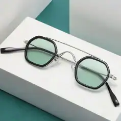 Stylish vintage sunglasses with green-tinted lenses and black frame, perfect for UV protection and fashion statement in summer or casual outings.